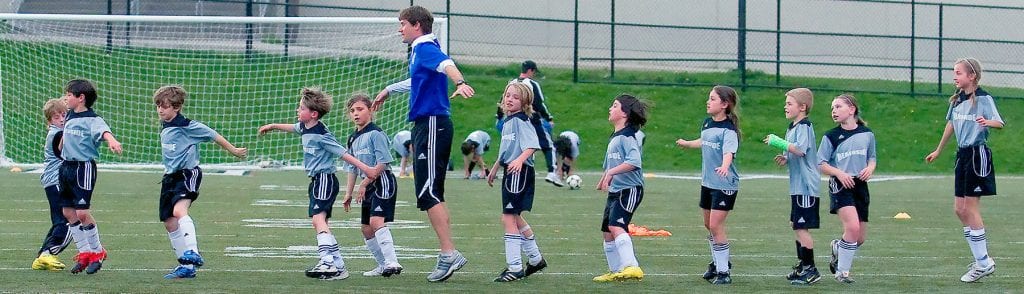 youth play soccer